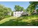 Expansive backyard featuring a lush lawn, mature trees, and a deck perfect for outdoor gatherings at 2647 Wood Hollow Dr, Dunwoody, GA 30360