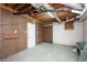 Unfinished basement with concrete floor, exposed ceiling and utilities at 2647 Wood Hollow Dr, Dunwoody, GA 30360