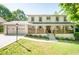 Charming two-story home with a landscaped front yard, two-car garage, and inviting front porch at 2647 Wood Hollow Dr, Dunwoody, GA 30360