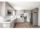 Updated kitchen with stainless steel appliances, custom cabinets, and granite countertops at 2647 Wood Hollow Dr, Dunwoody, GA 30360