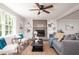 Inviting living room with fireplace, built-in bookshelves, and plush seating at 2647 Wood Hollow Dr, Dunwoody, GA 30360