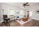 Bright living room with decorative seating, stylish furnishings, and natural light streaming through large windows at 2647 Wood Hollow Dr, Dunwoody, GA 30360