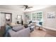 Inviting living room with comfortable seating, a console table, and large windows offering plenty of natural light at 2647 Wood Hollow Dr, Dunwoody, GA 30360