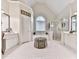 Luxurious bathroom showcasing a soaking tub, glass shower, and dual vanity sinks at 3280 Peace Ln, Suwanee, GA 30024