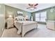 Well-appointed bedroom featuring a queen-size bed and decorative lamps, creating a cozy atmosphere at 3280 Peace Ln, Suwanee, GA 30024