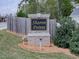 Entrance sign for Sharon Pointe, nestled beside green lawns and lush plantings at 3280 Peace Ln, Suwanee, GA 30024