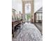 Bright foyer features a tall arched window, double doors, and an elegant piano and bench at 3280 Peace Ln, Suwanee, GA 30024