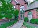 Charming front entrance with well-maintained landscaping and arched windows on a brick facade at 3280 Peace Ln, Suwanee, GA 30024