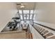 Open-concept interior with a view of the kitchen and dining area from the second-story landing at 3280 Peace Ln, Suwanee, GA 30024