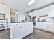 Open kitchen layout with a central island, stainless steel appliances, and ample cabinet space at 3280 Peace Ln, Suwanee, GA 30024