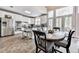 Eat-in kitchen featuring stainless steel appliances, island seating, and access to the outdoors at 3280 Peace Ln, Suwanee, GA 30024