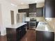 Well-equipped kitchen with a granite countertops, stainless steel appliances, and large island at 3352 Brockenhurst Dr, Buford, GA 30519