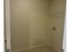 This is a simple laundry room with washer and dryer hookups and a wire shelf at 3352 Brockenhurst Dr, Buford, GA 30519