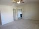 Spacious main bedroom featuring neutral carpet and en-suite bathroom access at 3352 Brockenhurst Dr, Buford, GA 30519