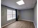 Finished basement space with wood look vinyl flooring and a window for natural light at 1514 Log Cabin Ln, Lawrenceville, GA 30045