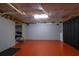 Unfinished basement space with painted floors and exposed ductwork for a customizable area at 1514 Log Cabin Ln, Lawrenceville, GA 30045