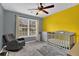 Bedroom/Bedroom with plush carpet, a ceiling fan, a crib and large windows at 1514 Log Cabin Ln, Lawrenceville, GA 30045