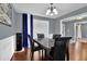 Elegant dining room featuring hardwood floors, wainscoting, a chandelier, and ample natural light at 1514 Log Cabin Ln, Lawrenceville, GA 30045