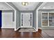 Inviting foyer with hardwood floors, neutral gray walls, white trim, and natural light from sidelight windows at 1514 Log Cabin Ln, Lawrenceville, GA 30045