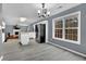 Bright kitchen open to the living room with stainless steel appliances and large window at 1514 Log Cabin Ln, Lawrenceville, GA 30045
