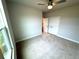 Bedroom featuring a double door closet, carpet flooring, and a ceiling fan at 1769 Rowland Pass, Buford, GA 30518