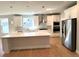 Modern kitchen with white cabinets, stainless steel appliances, and a large island with countertop at 1769 Rowland Pass, Buford, GA 30518