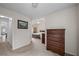 Neutral bedroom with tan carpet and a dark wood dresser at 1905 Cottage Grove Way, Cumming, GA 30040