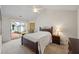Bedroom with sliding glass door to patio and tan carpet at 1905 Cottage Grove Way, Cumming, GA 30040