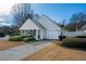 Charming single-story home with manicured lawn and attached two-car garage at 1905 Cottage Grove Way, Cumming, GA 30040