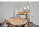 Open kitchen/dining space with skylights and ample seating at 1905 Cottage Grove Way, Cumming, GA 30040