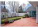 Private backyard patio with brick pavers and white fence at 1905 Cottage Grove Way, Cumming, GA 30040