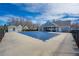 Community pool covered for the winter with a nearby pergola and walkway, surrounded by a black fence at 1905 Cottage Grove Way, Cumming, GA 30040