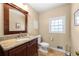 Bathroom with granite countertops, modern faucet, and neutral color scheme at 491 Lees Sw Trce, Marietta, GA 30064