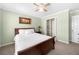 Bedroom featuring a wooden bed frame, ceiling fan, and closet at 491 Lees Sw Trce, Marietta, GA 30064