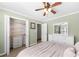 Cozy bedroom with closet space, a dresser, a ceiling fan, and neutral-colored walls at 491 Lees Sw Trce, Marietta, GA 30064