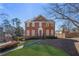 Charming two-story brick home with a manicured lawn and a welcoming entrance at 491 Lees Sw Trce, Marietta, GA 30064