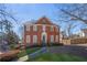 Charming two-story brick home with a manicured lawn and a welcoming entrance at 491 Lees Sw Trce, Marietta, GA 30064