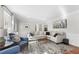 Cozy living room featuring a large sectional sofa, hardwood floors, and natural light at , Marietta, GA 30064