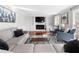 Bright living room with fireplace, built-ins, hardwood floors, and ample seating at 491 Lees Sw Trce, Marietta, GA 30064