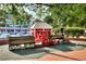 Charming outdoor train display with a vintage-style engine and waiting room replica at 491 Lees Sw Trce, Marietta, GA 30064