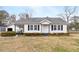 Charming single-story home with covered porch and black shutters, set on a spacious lot at 116 Poplar St, Fairburn, GA 30213