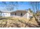View of the home's backyard featuring a brick exterior and lawn at 2917 1St Sw Ave, Atlanta, GA 30315
