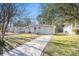 Charming single-story home featuring a well-maintained lawn, inviting walkway, and freshly painted exterior at 2917 1St Sw Ave, Atlanta, GA 30315