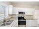 Well-equipped kitchen featuring stainless steel appliances and a large sink at 2917 1St Sw Ave, Atlanta, GA 30315