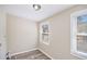 Cozy laundry room features modern flooring, neutral paint, and a bright window at 2917 1St Sw Ave, Atlanta, GA 30315