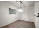 Bright dining area with wood floors, decorative chandelier, and textured glass window at 400 17Th Street Nw # 1304, Atlanta, GA 30363