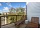 Relax on this balcony with wooden lounge chairs and a beautiful view of the surrounding neighborhood at 1113 Rivard Nw Cir, Atlanta, GA 30318