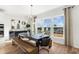 Bright dining room with large windows, modern light fixture, and hardwood floors at 1113 Rivard Nw Cir, Atlanta, GA 30318