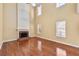 Bright living room with hardwood floors, fireplace, and lots of natural light at 13060 Crabapple Lake Dr, Roswell, GA 30076