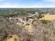 Picturesque aerial shot of a neighborhood nestled among dense trees, showcasing the landscape at 1348 Ewing Creek Dr, Dacula, GA 30019